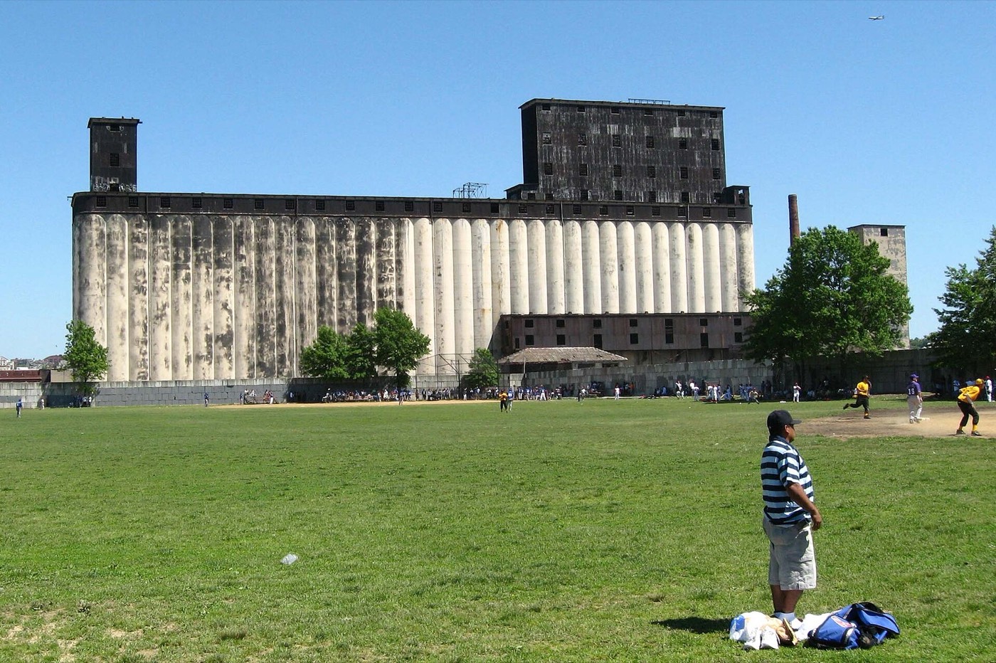 The full length of the grain terminal seen from across an open field