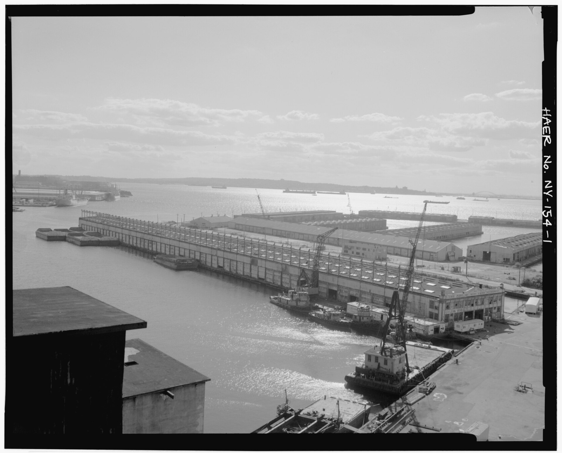 Archival view southwest from the top of the grain elevator over the terminal pier