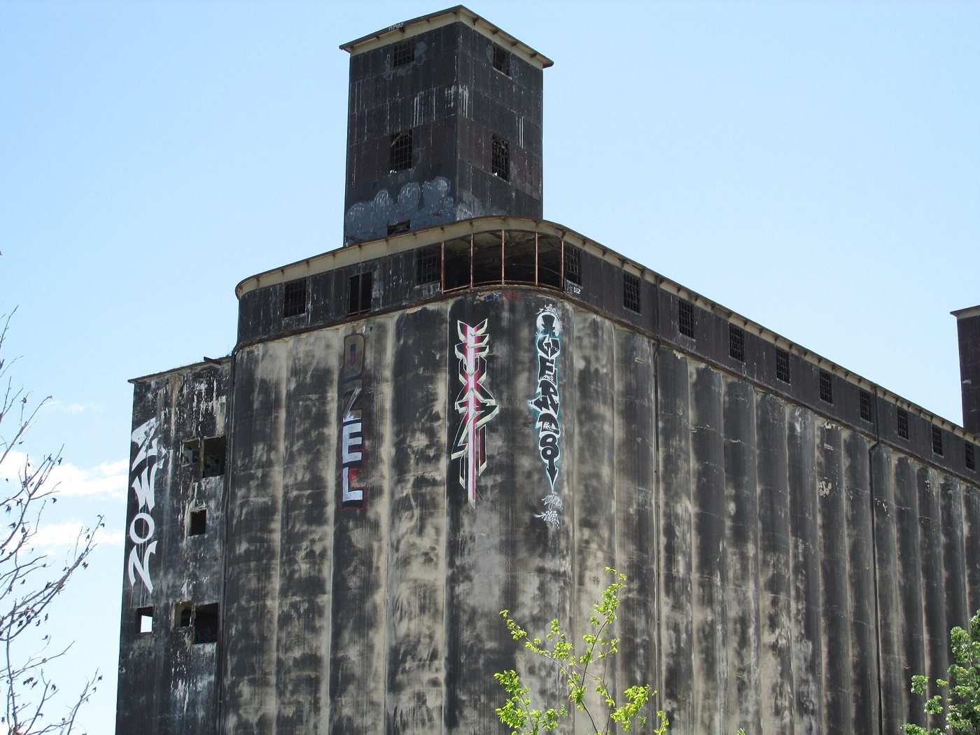 Low-angle view of the grain terminal's concrete tower with graffiti